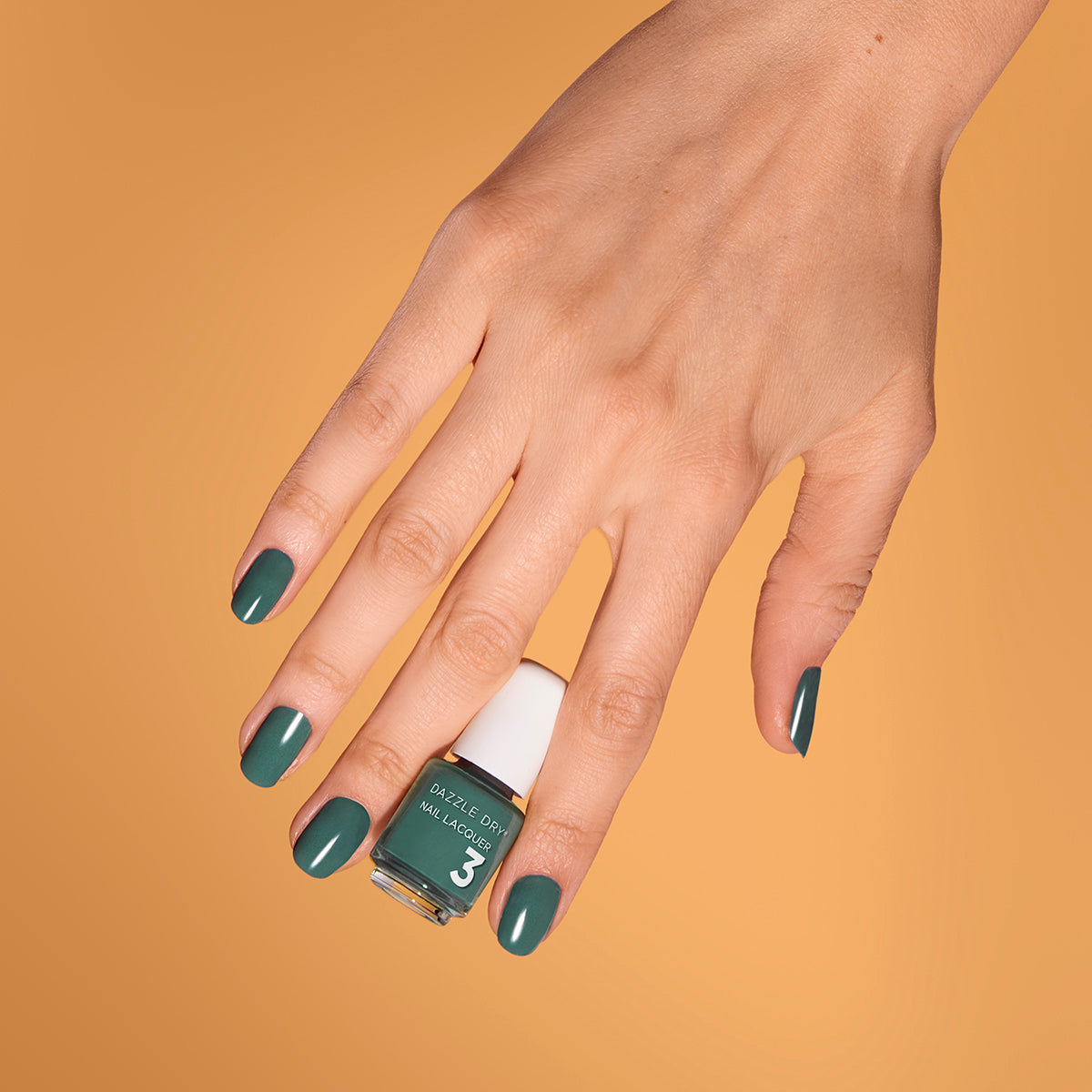 Hand with 3-Day Weekend painted on nails holding mini lacquer bottle