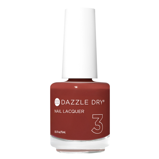 A bottle of Dazzle Dry Nail Lacquer in shade 3, featuring a deep reddish-brown color with a white cap, set against a plain white background.