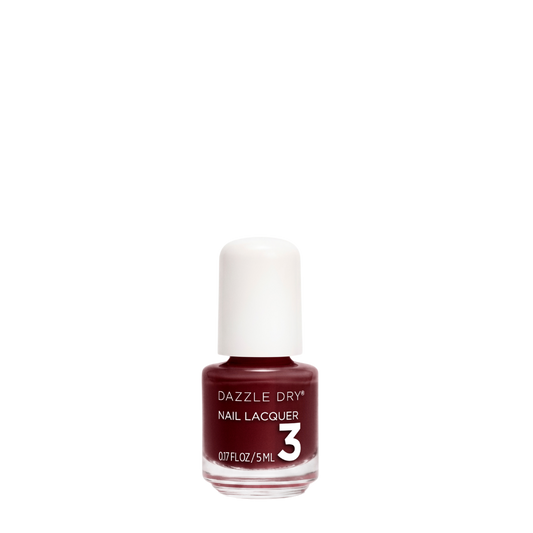 A bottle of Dazzle Dry Nail Lacquer in shade 3, featuring a deep burgundy red color with a white cap, set against a plain white background.