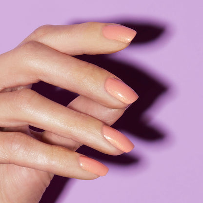 Hand with Sunset Glow painted on nails