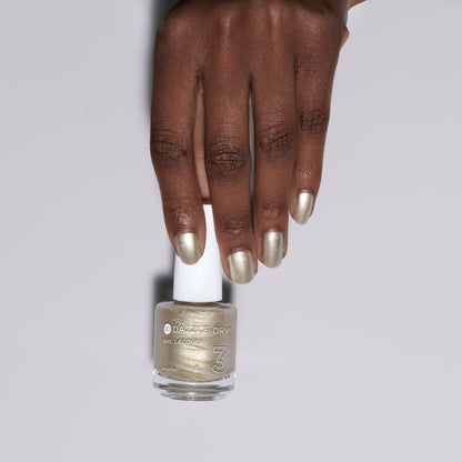 Hand with Illuminate painted on nails holding nail lacquer bottle