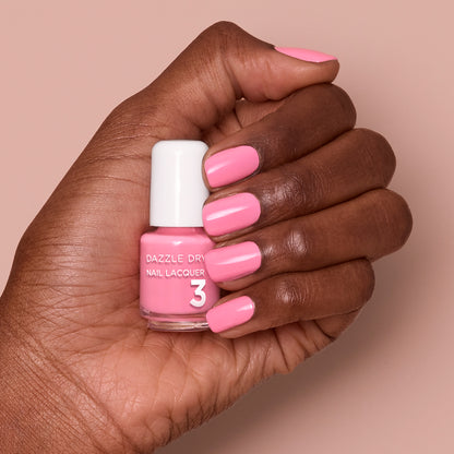 Hand with Soulmate painted on nails holding mini lacquer bottle