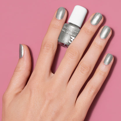 Hand with Love Potion painted on nails holding Mini lacquer bottle 