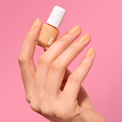 Hand Holding Mini Size Creamsicle Painted on the nails