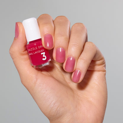 Hand with Sugar Dipped painted on nails holding mini lacquer bottle