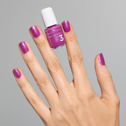 Hand with Mulberry painted on nails holding mini lacquer bottle