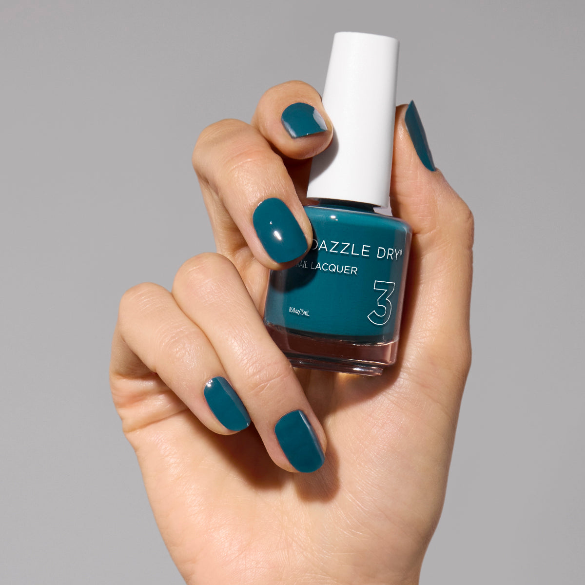 Hand with My Serenity painted on nails holding lacquer bottle