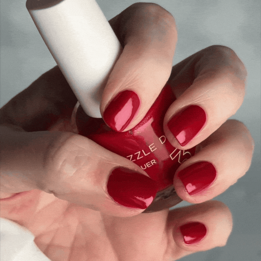 Hand Holding Mini Size Coastal Apple Of My Eye Painted on the nails