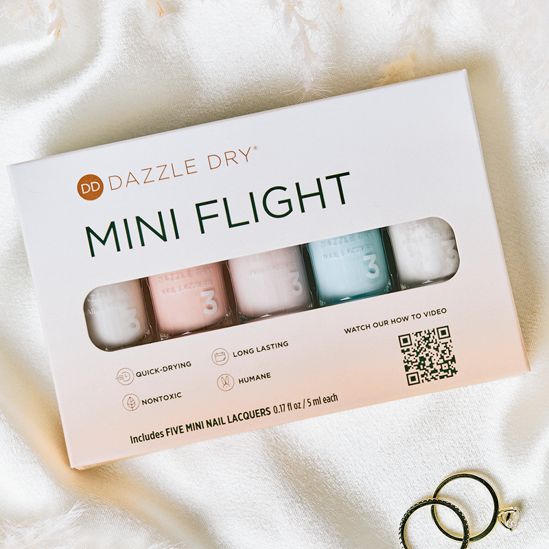 I Do Mini Flight - Dazzle Dry nail lacquers next to rings