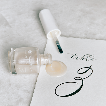 Pearl Lacquer Bottle open and spilt on piece of paper