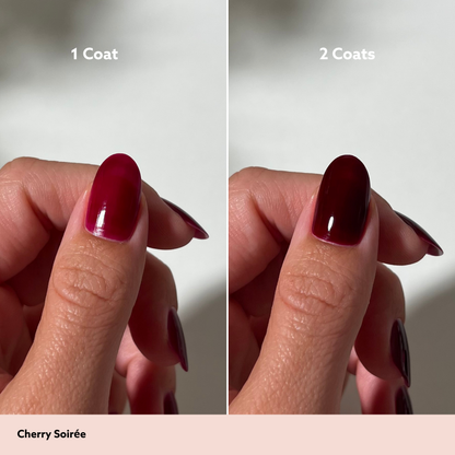 A split-screen comparison showing a fingernail polish swatch labeled '1 Coat' on the left and '2 Coats' on the right, with the shade name 'Cherry Soirée' at the bottom. The polish appears as a deep cherry red on one side and a darker, near-black cherry red on the other.