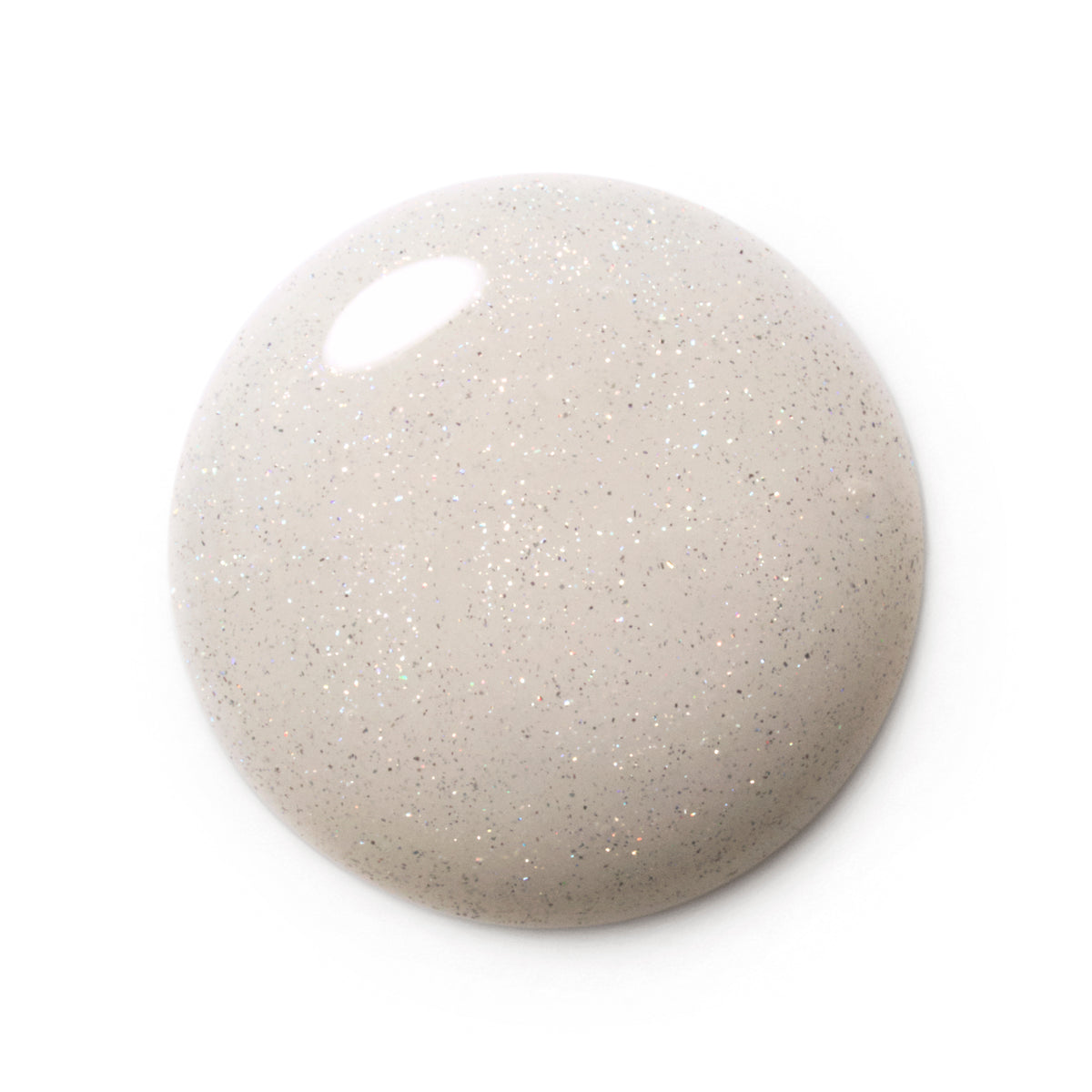 A glossy, rounded droplet of glittery nail polish in a light beige-gray shade with fine silver and gold flecks, shown on a solid white background.