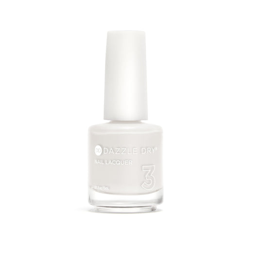 A bottle of Dazzle Dry nail lacquer in shade 3, featuring a white cap and a clear glass bottle containing a very pale, off-white nail polish, set against a solid white background.