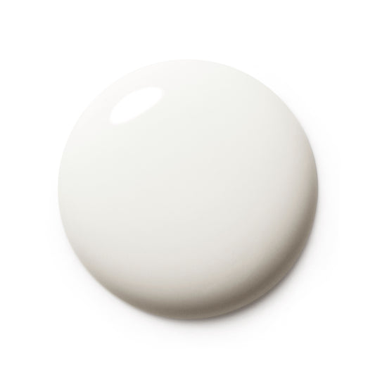 A smooth, glossy, off-white circular droplet or swatch on a solid white background.