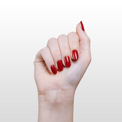 Hand with Ember painted on nails