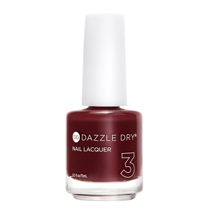 A bottle of Dazzle Dry Nail Lacquer in shade 3, featuring a deep burgundy red color inside a clear glass bottle with a white cap, set against a plain white background.