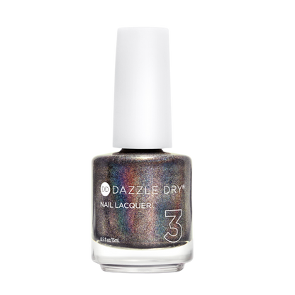 A bottle of Dazzle Dry Nail Lacquer in a shimmery, holographic metallic shade with silver, bronze, and purple tones, featuring a white cap on a plain white background.