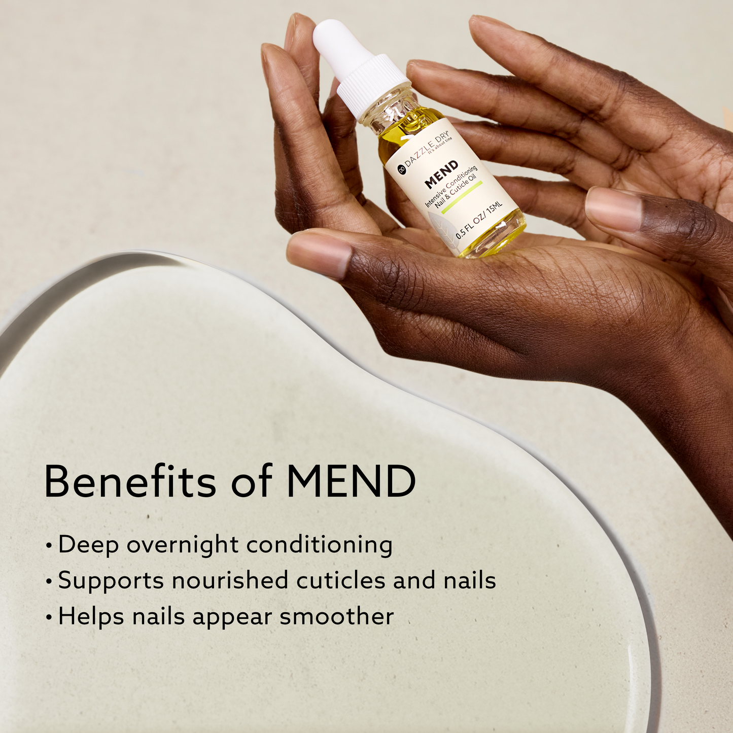 Hand holding MEND Intensive Conditioning Nail & Cuticle Oil by Dazzle Dry with text noting deep overnight conditioning, cuticle nourishment, and smoother nails on a neutral background