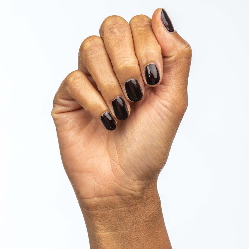 Hand with Merlot painted on nails