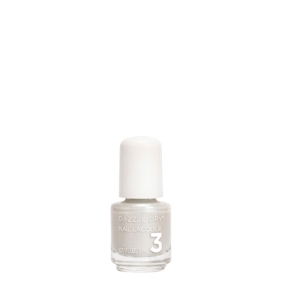 A bottle of Dazzle Dry Nail Lacquer in shade 3, featuring a white cap and a clear glass bottle showing a light, warm off-white nail polish inside, set against a solid white background.