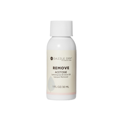 Bottle of Dazzle Dry acetone-based nail polish remover on a white background