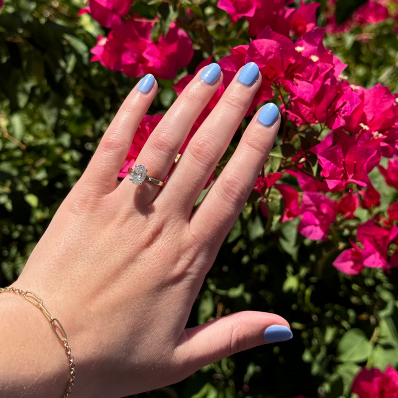 Hand with Sail Away painted on nails 