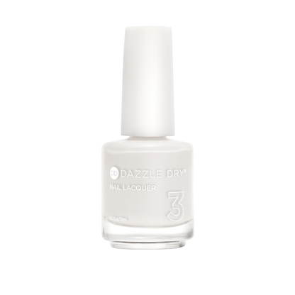 A bottle of Dazzle Dry Nail Lacquer in a solid off-white shade, featuring a white cap and clear glass bottle on a plain white background.