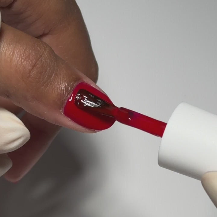 Painting Rapid Red on nails