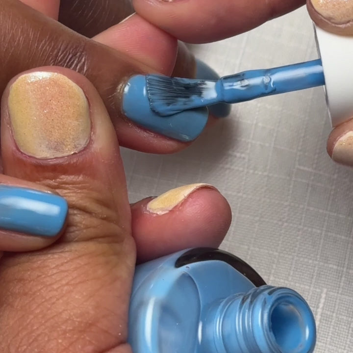 Painting Varsity Blues on nails