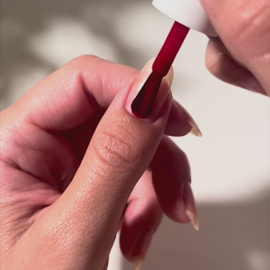 Painting Rapid Red on nails