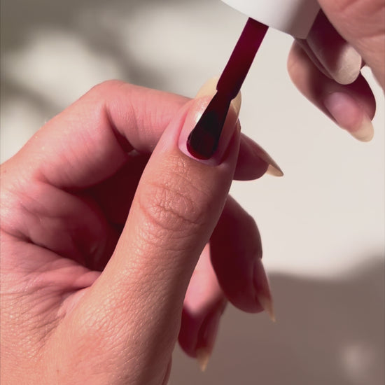 Painting C E O on nails