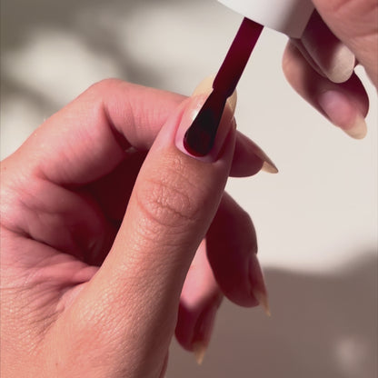 Painting C E O on nails