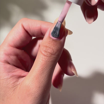 Painting Xoxo on nails