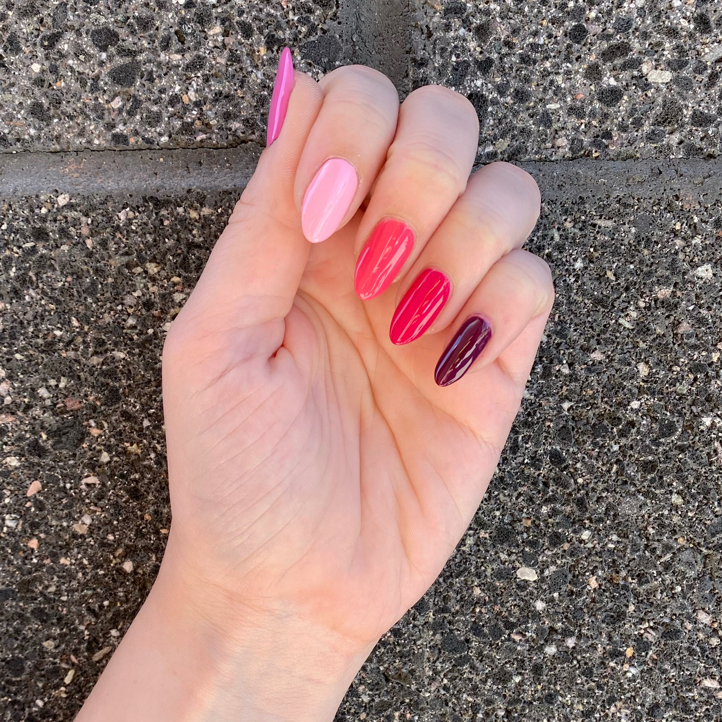 Hand with Coronado Mini Flight shades painted on nails