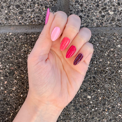 Hand with Coronado Mini Flight shades painted on nails