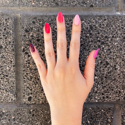 Hand with Coronado Mini Flight shades painted on nails