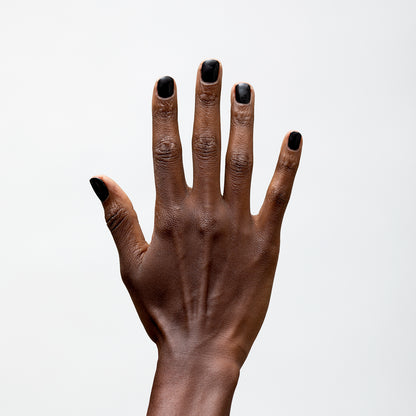 Hand with Bold painted on nails