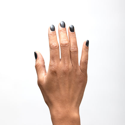 Hand with Bold painted on nails