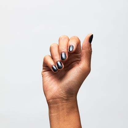 Hand with Bold painted on nails