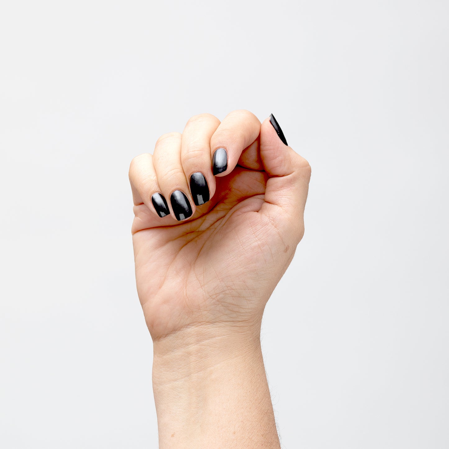 Hand with Bold painted on nails