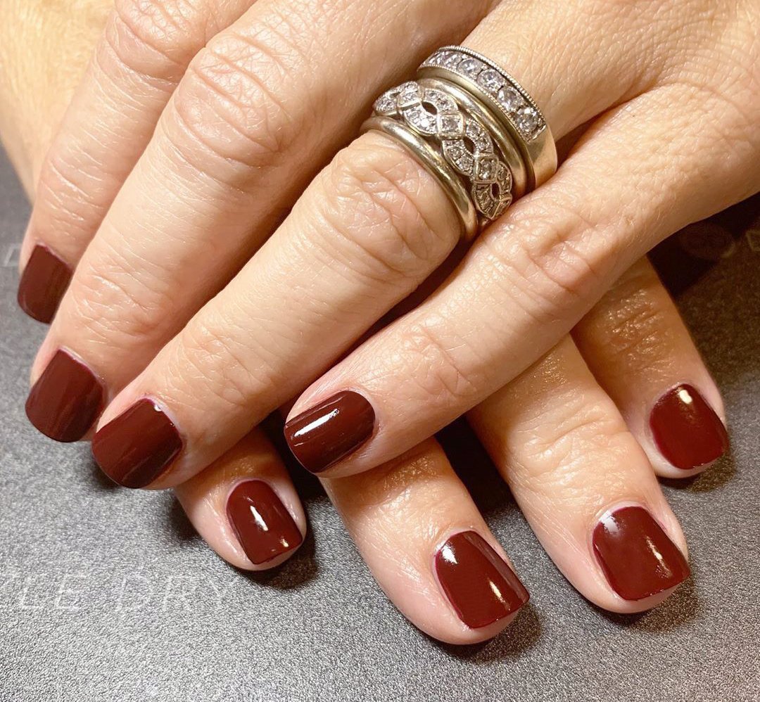 Hands with Passionate Red painted on nails