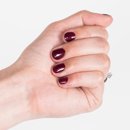 Hand with Red Rouge painted on nails