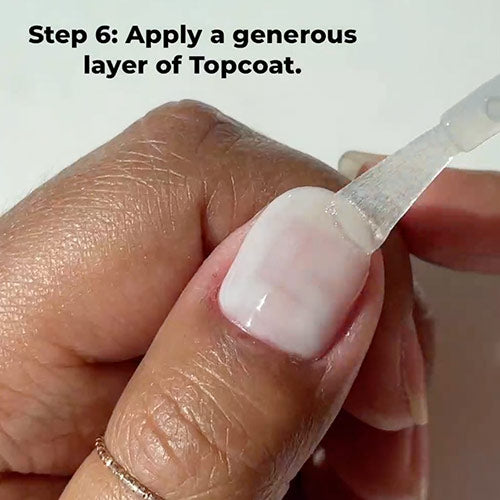 Painting Breathe Free on nails