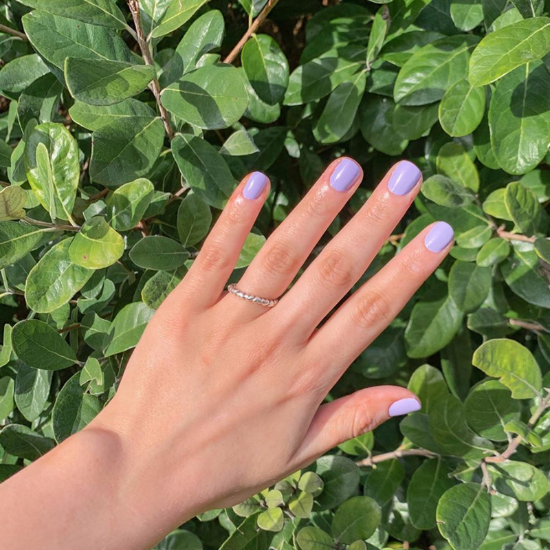 Hand with Faith painted on nails