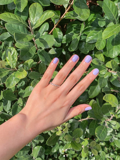 Hand with Faith painted on nails